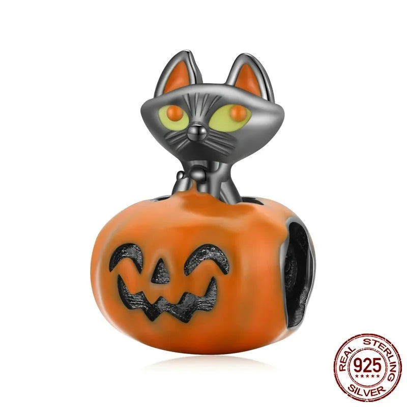 Close-up of sterling silver pumpkin black cat pendant with black gold plated oil dripping finish