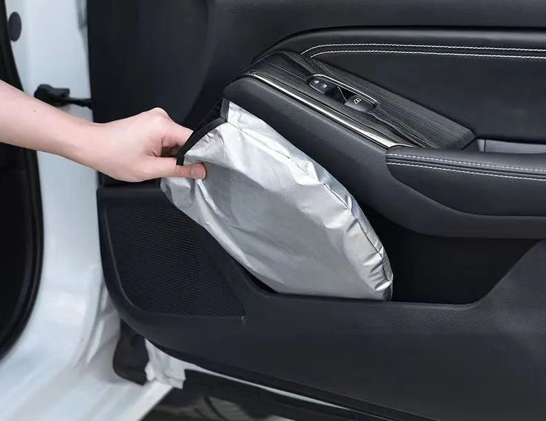 Aluminium foil car sunshade in titanium silver colour, folded flat.