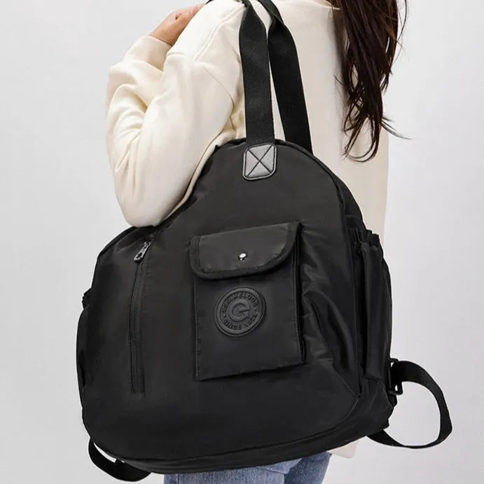 Large lightweight nylon backpack in khaki colour with a front sandwich pocket.