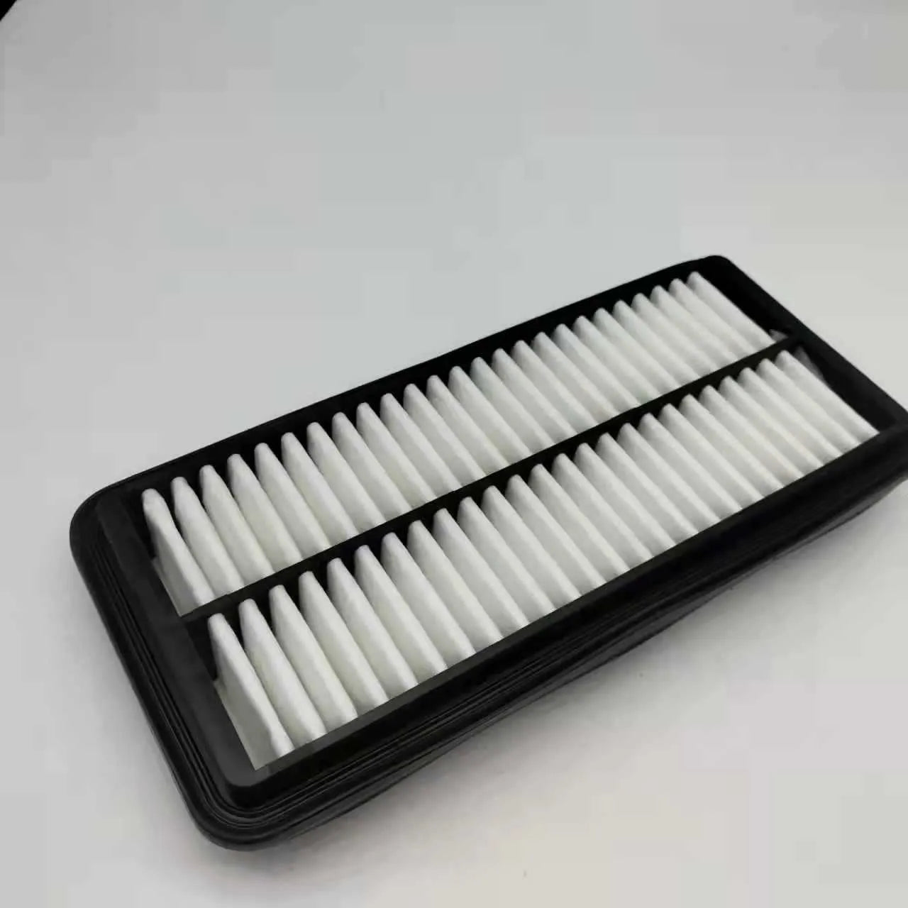 Black rectangular car panel air filter with dimensions 256mm by 113mm by 40mm
