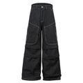 Black pleated work trousers with multiple pockets, mid waist cut, and zip fly in cotton denim fabric