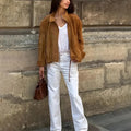 A loose-fitting solid colour long sleeve jacket on a white background.