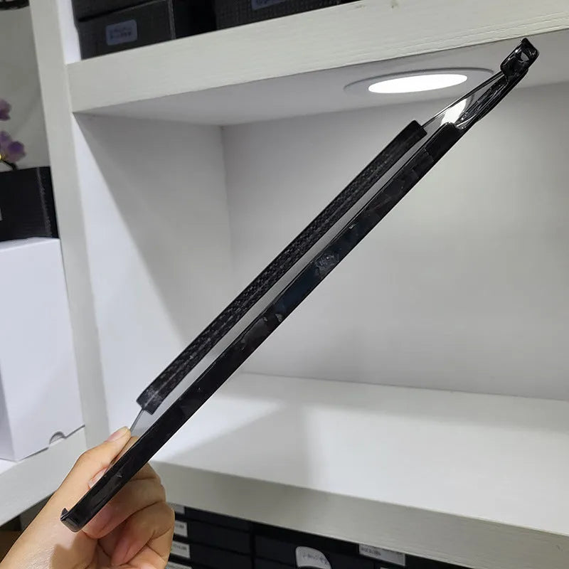 Carbon fibre hard protective case for iPad Pro 11 showing forged surface texture