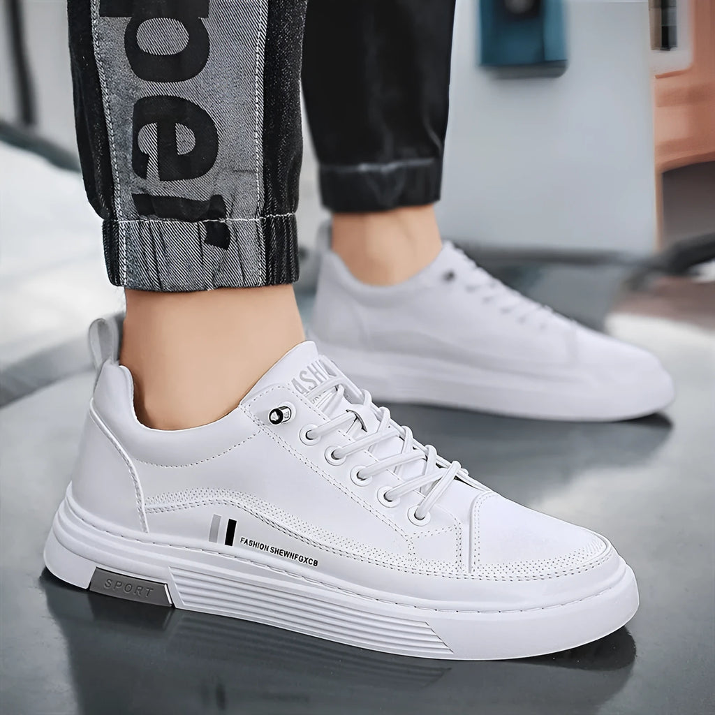 Men's white skate shoes with elastic band closure and low-top design showing stitching details