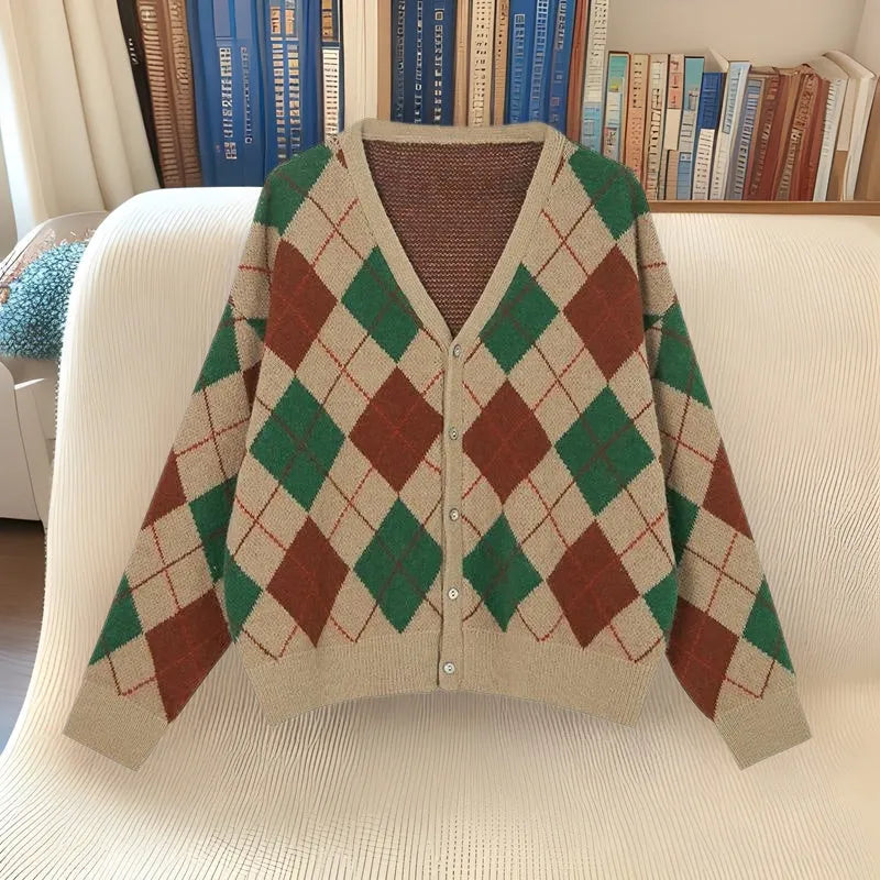 A knitted casual cardigan coat in a macaron colour, shown on a hanger with regular sleeves.