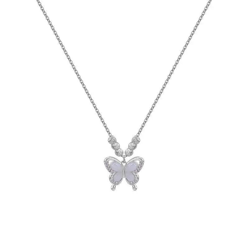Women's silver butterfly opal pendant necklace on a cross chain, showing adjustable length.