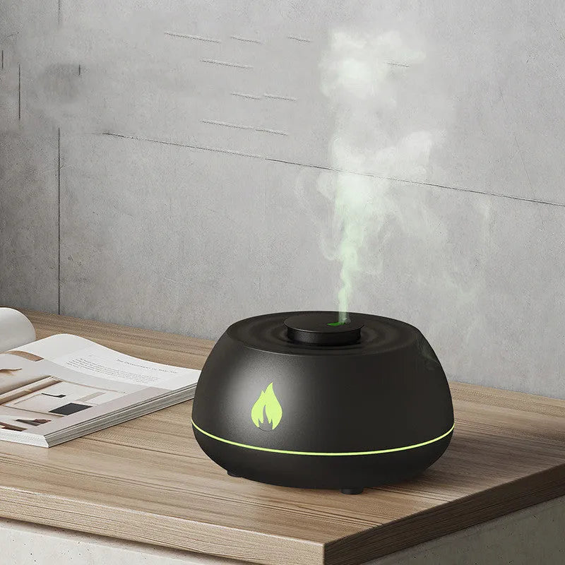 Black flame humidifier aroma diffuser with 130ml tank, 7 colour lights, and USB power on a wooden table