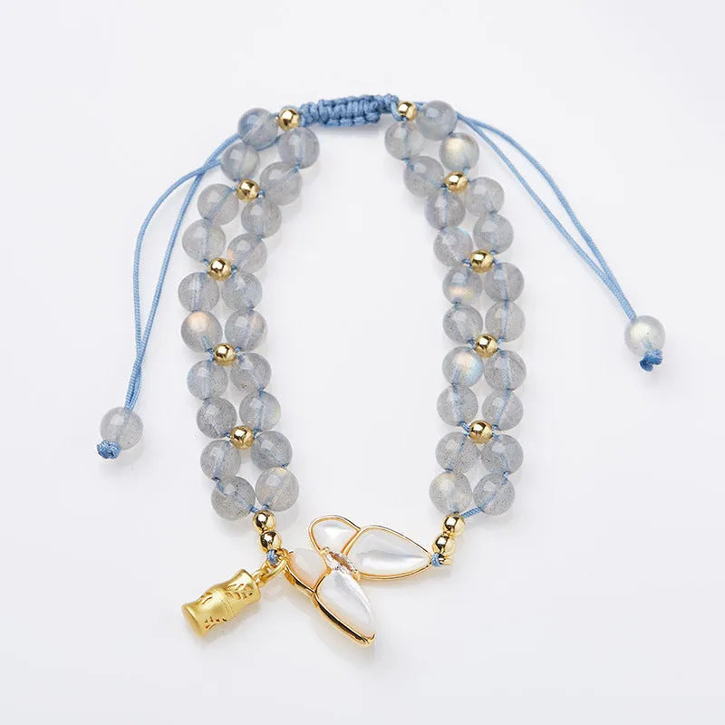 Gray moonstone bracelet with butterfly woven rope design and geometric retro styling