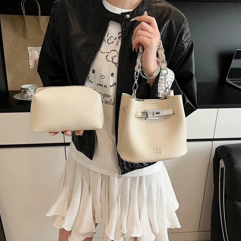Soft PU leather retro bucket shoulder bag in black showing internal organiser pockets.