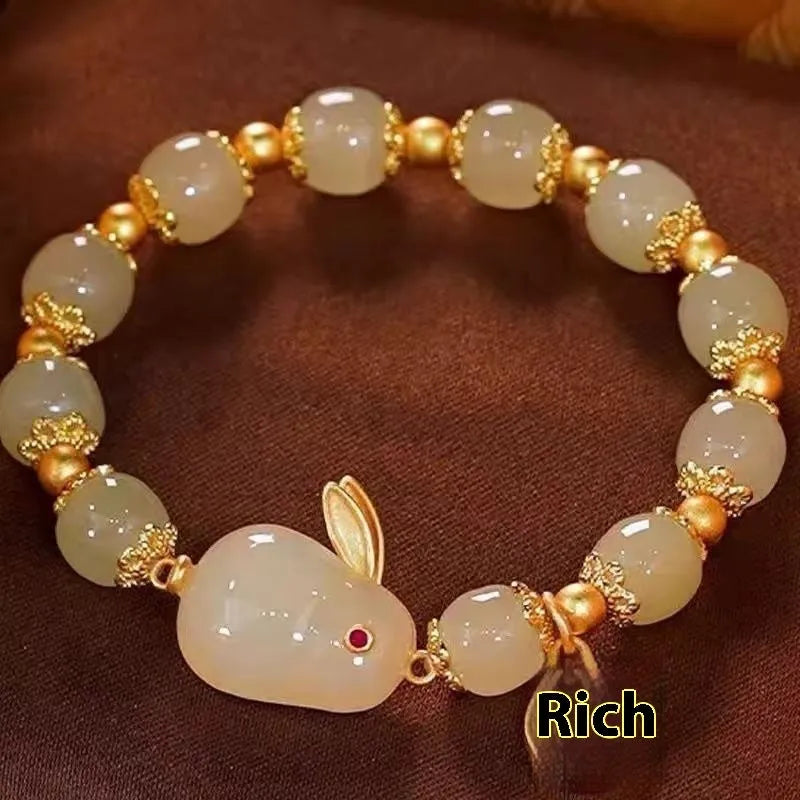 Green lucky jade hare bracelet for women with Chinese zodiac animal design and electroplated finish.