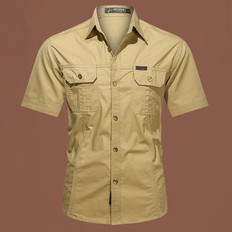 Man wearing a loose-fit army green short sleeve cotton work shirt with a cardigan style.