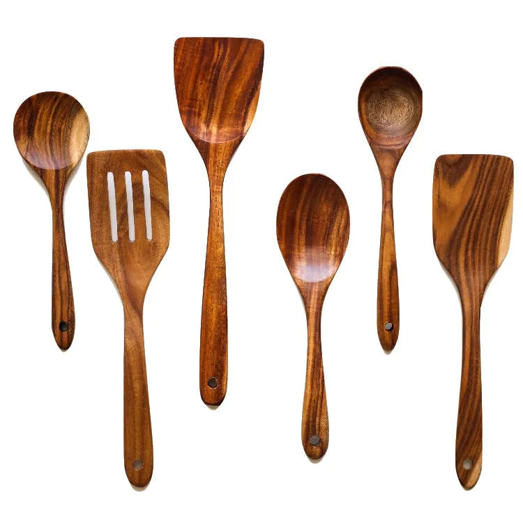 Seven wooden spoon shovels arranged together as a cooking utensil set for non-stick pans