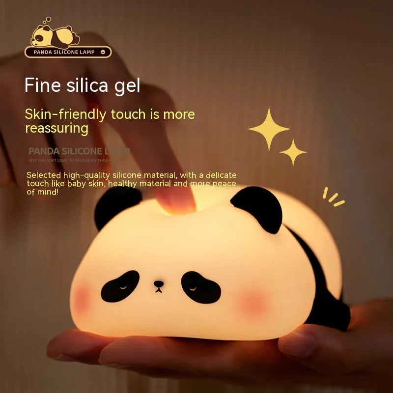 Cartoon panda-shaped silicone night light for children on a table.