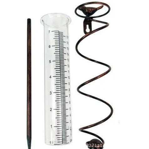 Cast iron bird ornament with glass rain measurement tube showing 0-800ml capacity scale