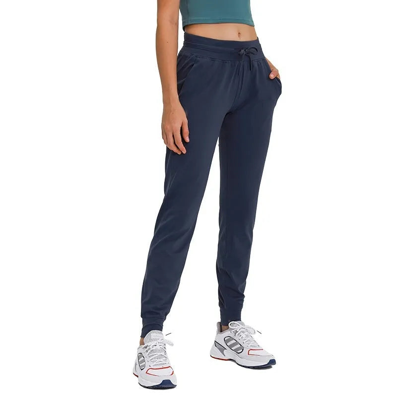 Women's high waist yoga pants with drawstring waistband in quick-drying elastic fabric