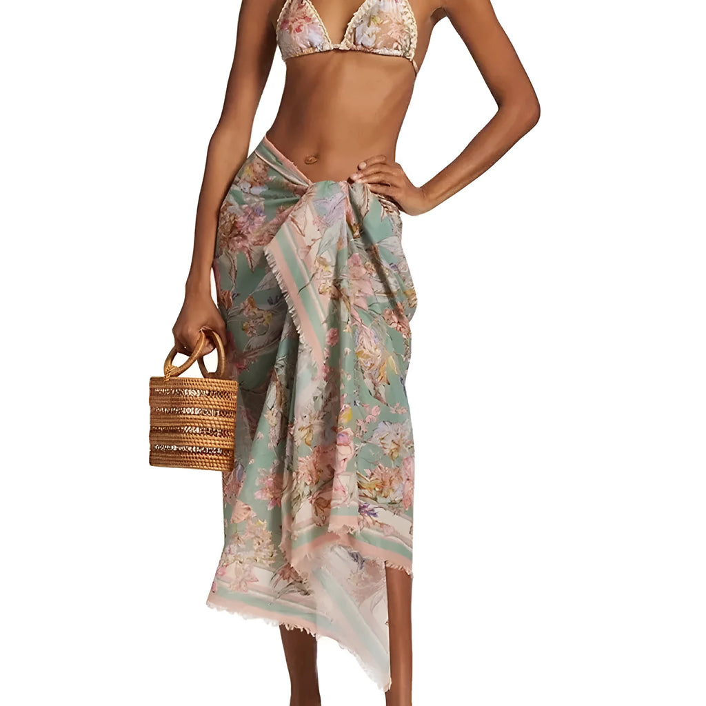 Women's creamy-white floral pattern bikini suit with matching skirt