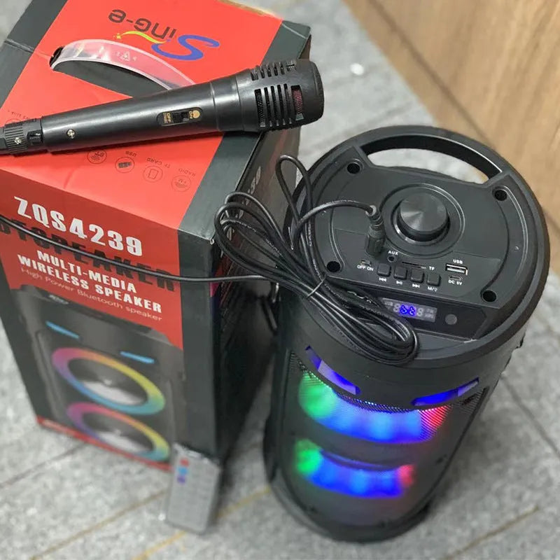 Black portable Bluetooth speaker with dual horn design and wheat detailing, showing USB port and card slot