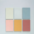 Large self-adhesive sticky notes in six colours measuring 12cm by 8cm, pack of 150 sheets for organisation