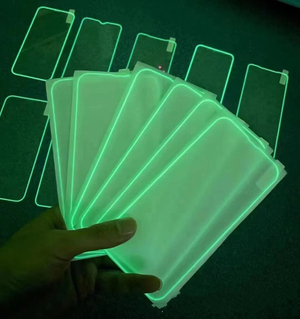 Fluorescent pink tempered glass screen protector glowing on an iPhone 13 Pro Max.