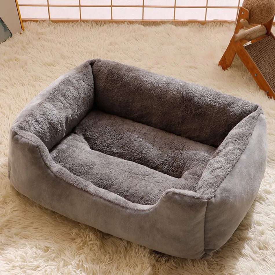 Short plush pet cushion bed for cats and dogs in grey colour, shown in L size 60x45 cm.