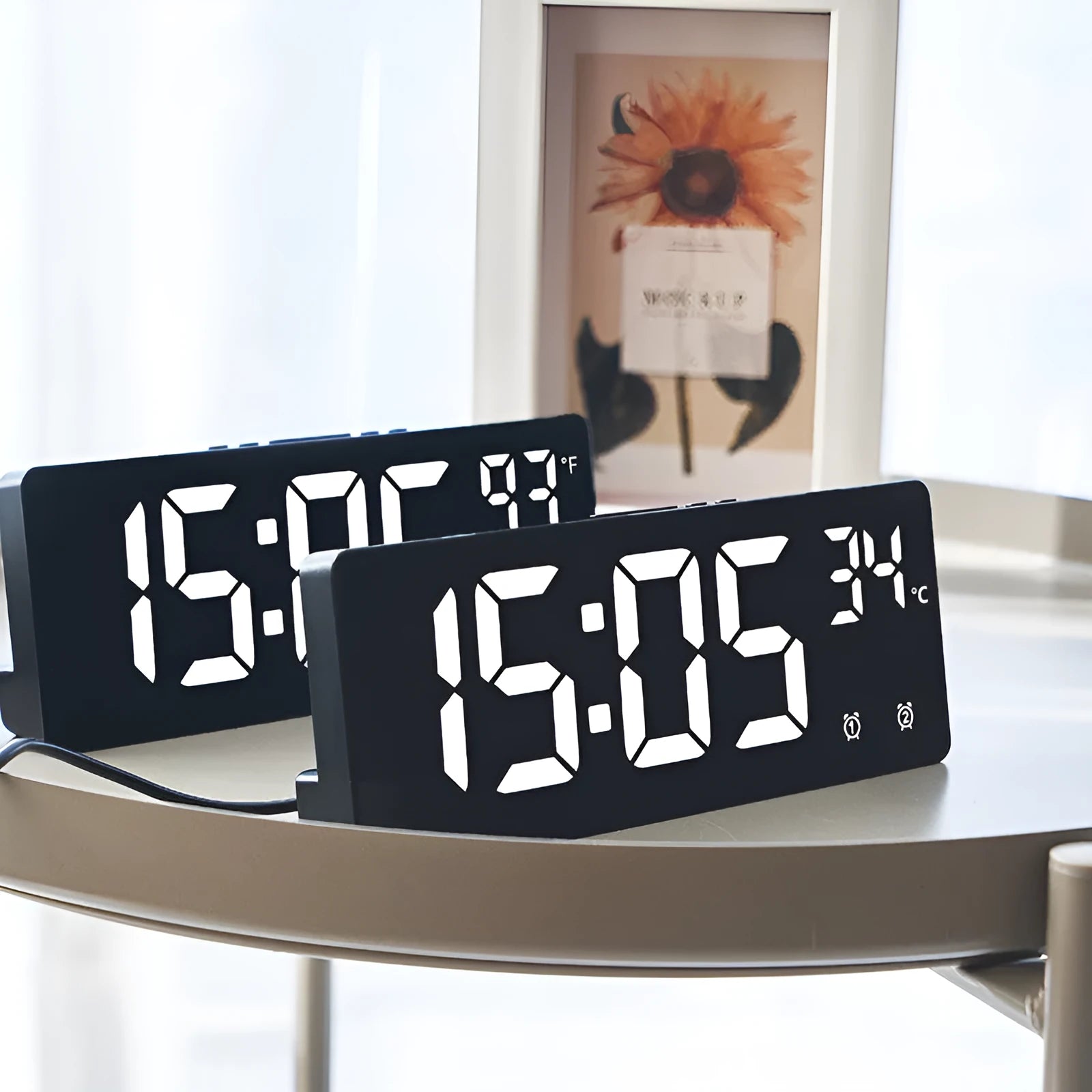 Electronic alarm clock with large LED screen showing time and temperature on desktop