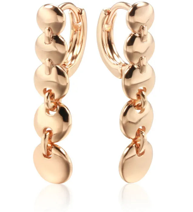 A pair of gold retro woven copper large circle hoop earrings.