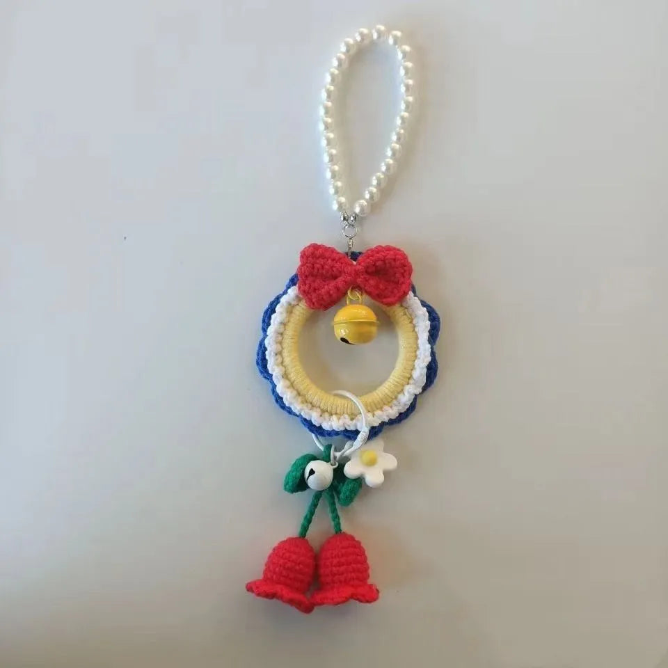 Handmade plush yarn Snow White character car hanging ornament on a clear background.