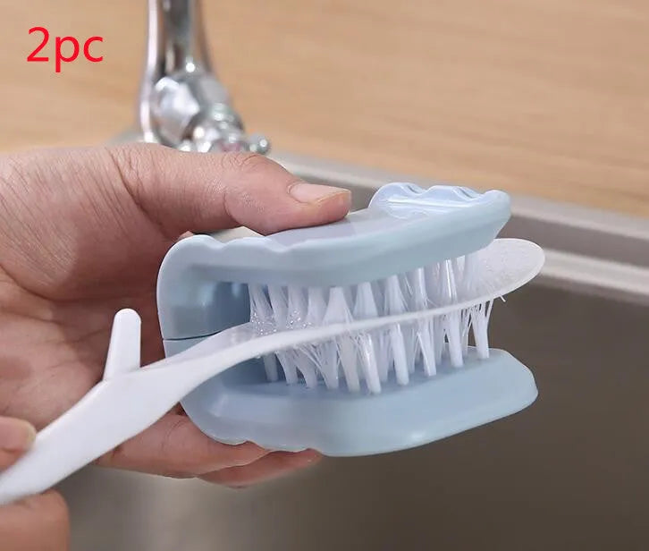 Blue U-shaped plastic brush with bristles for cleaning knives and cutlery in a kitchen.