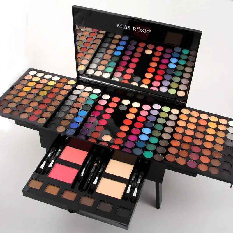 Piano-shaped makeup palette open to show 180 eyeshadows, 2 blushes, and 8 contour powders