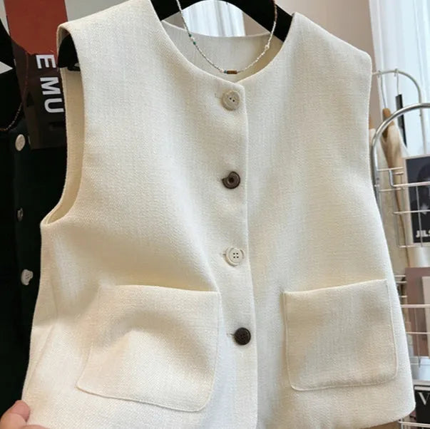 Women's sleeveless polyester bandage vest dress with round neck in milky white.