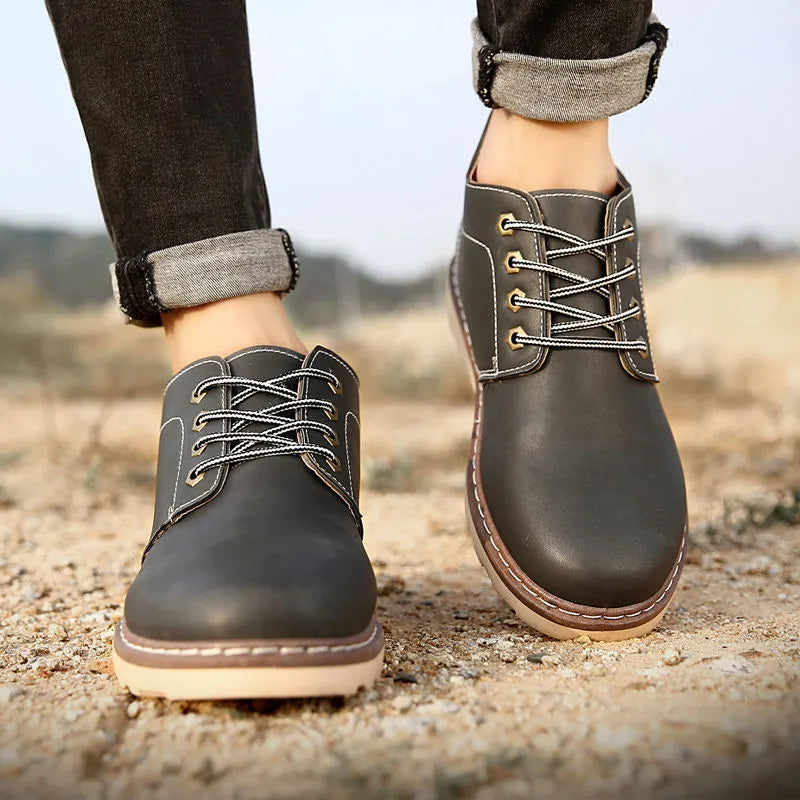 Men's black mid-top waterproof boots with flat rubber sole and PU upper