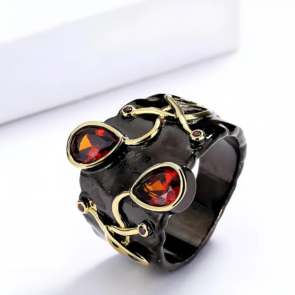 Retro women's brass oval ring in black finish on white background