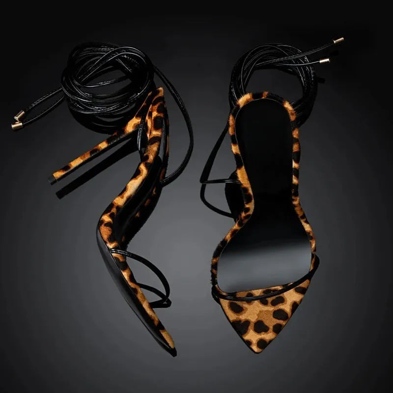 Women's leopard print Roman sandals with pointed toe and buckle fastening strap.