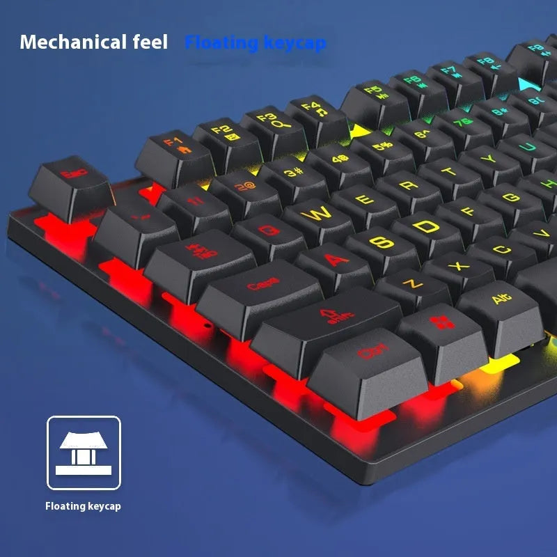 FV-Q1 wired luminous keyboard with six-colour backlight on a desk, connected to a computer