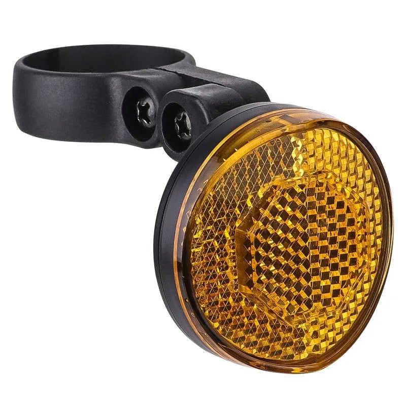 Red plastic anti-theft bicycle taillight bracket mounted on seat post with reflective surface