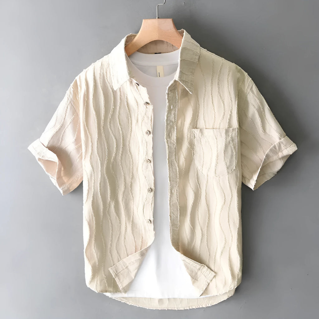 Man wearing a loose-fit apricot pure cotton short sleeve casual shirt with a Japanese fresh style.