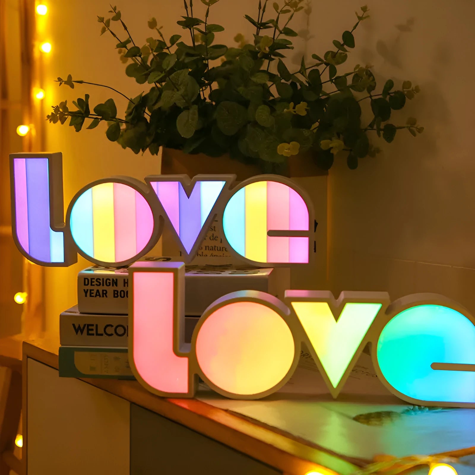 Rainbow halo style LED LOVE decorative light measuring 35.5cm wide