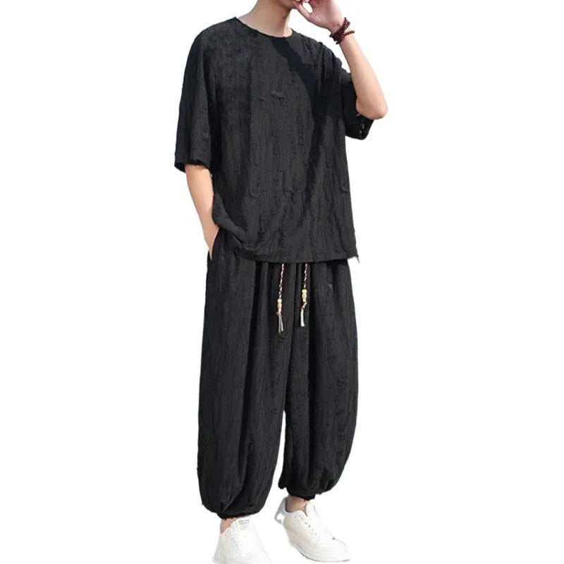 Men's loose two-piece summer suit set with thin short-sleeved top and cropped trousers in black or grey