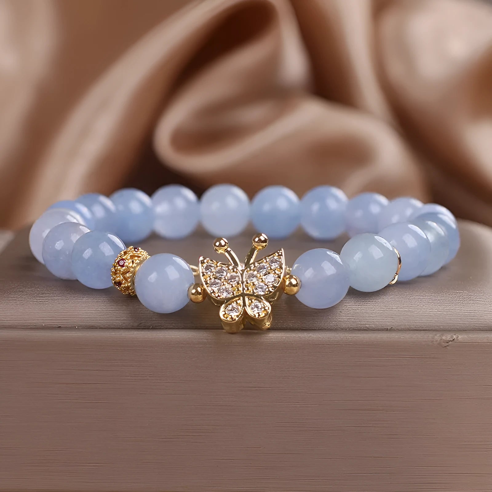 Sky blue aquamarine butterfly crystal bracelet with pearls and rhinestones measuring 17cm length