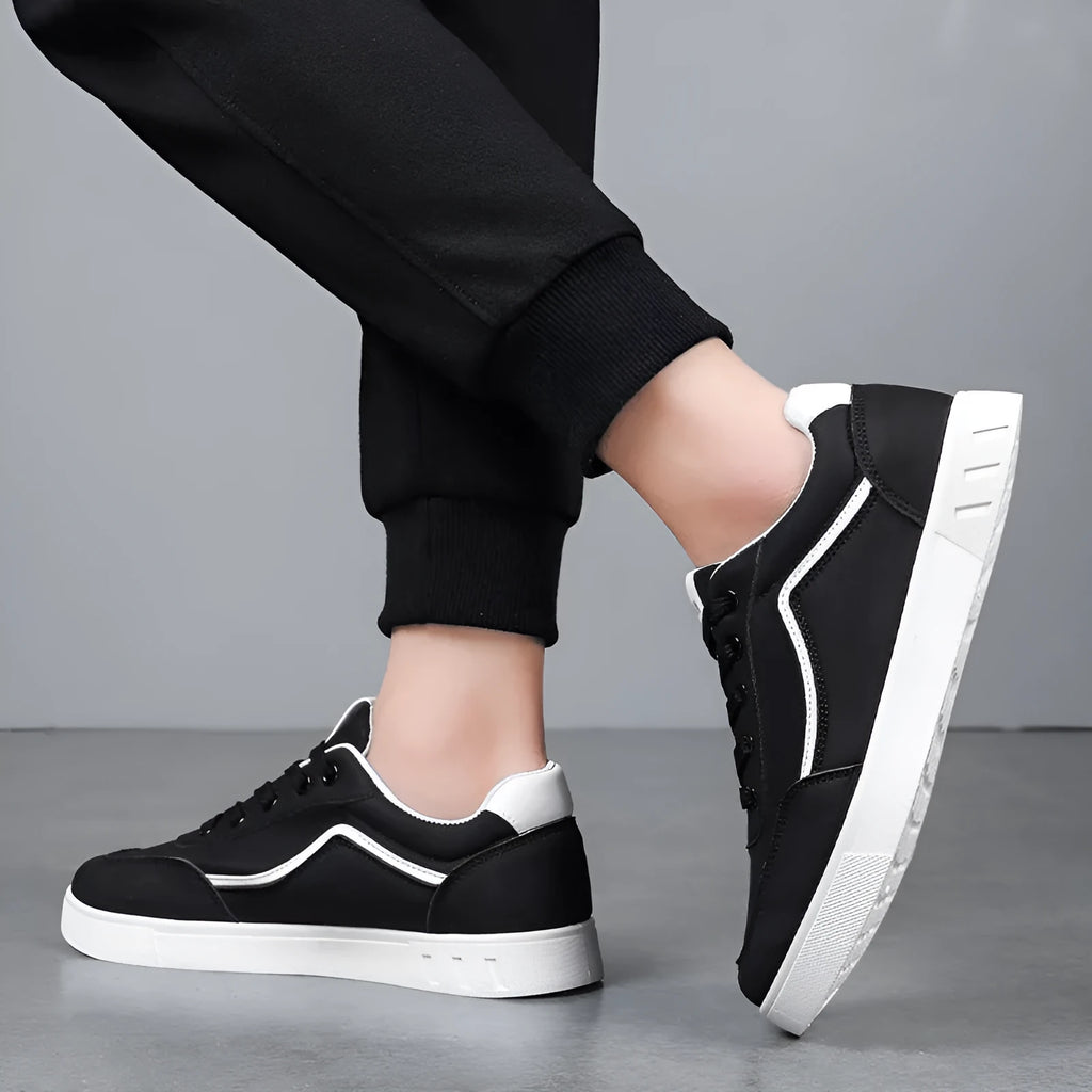 Black and white board shoes with mesh lining and rubber soles for casual wear