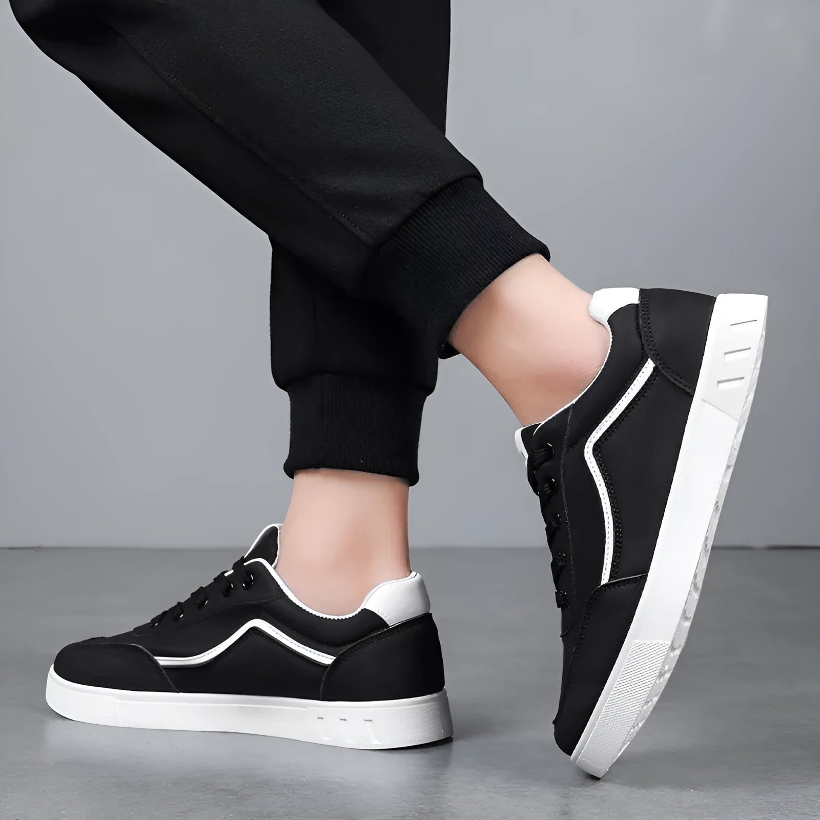 Black and white board shoes with mesh lining and rubber soles for casual wear