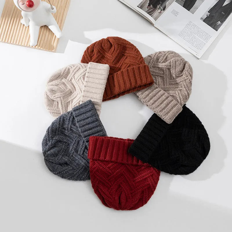 Wool knitted dome crown beanie hat for women in ankela red with a totem pattern.