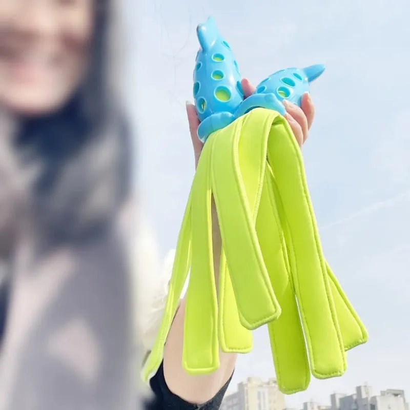 Blue cuttlefish-shaped dog chew toy with squeaky sound device for interactive play