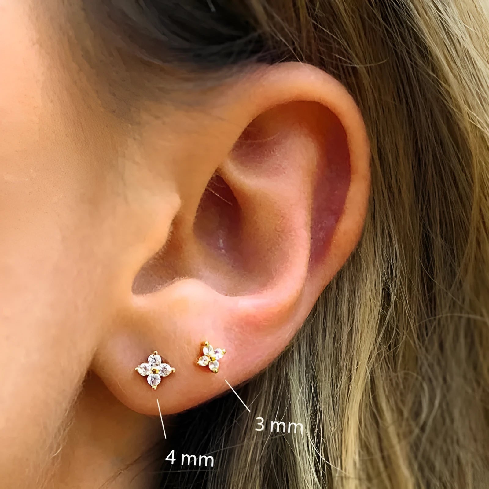 S925 sterling silver stud earrings with a petal-shaped crystal flower design in gold or platinum plating.