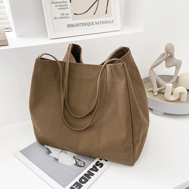 Solid colour women's canvas handbag with double shoulder straps and large shopping capacity