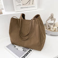 Solid colour women's canvas handbag with double shoulder straps and large shopping capacity