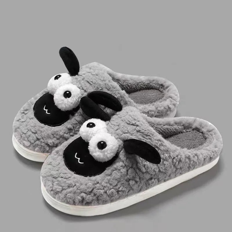 Brown slip-on slippers with suede upper and lamb thermal cotton lining on wooden floor