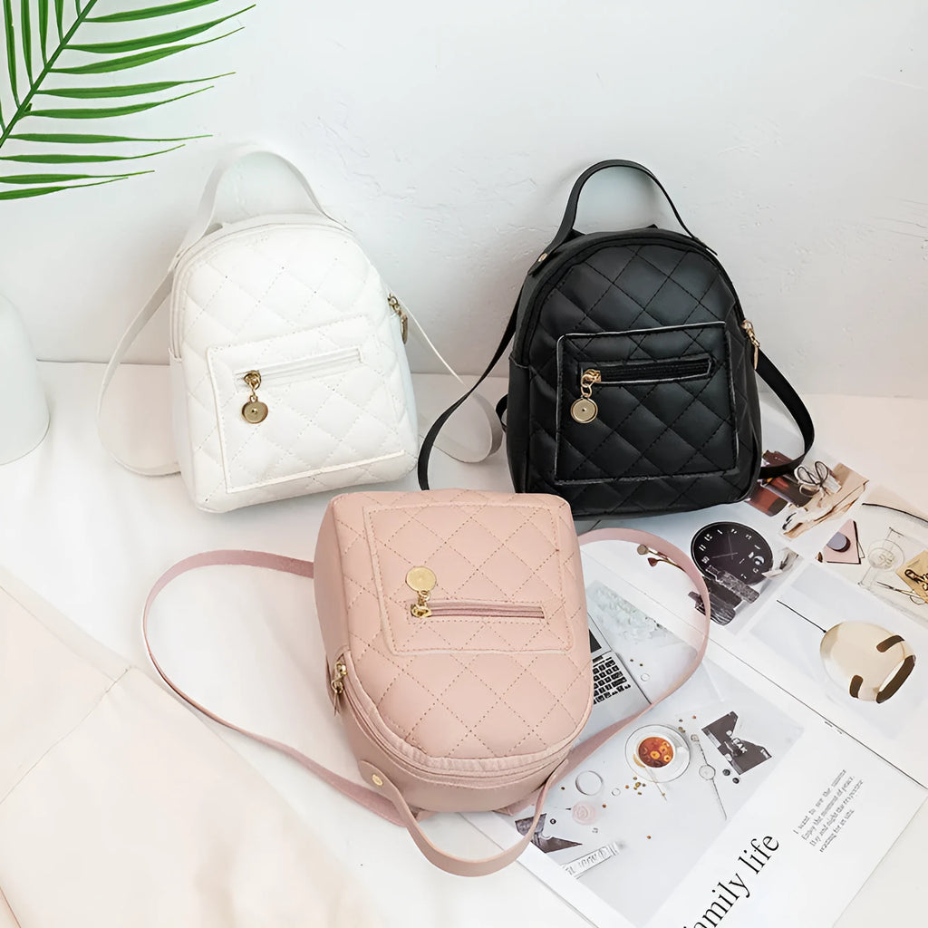 Hard square vertical girls' backpack in PU with embroidery, showing front sandwich pocket and soft carry handle.