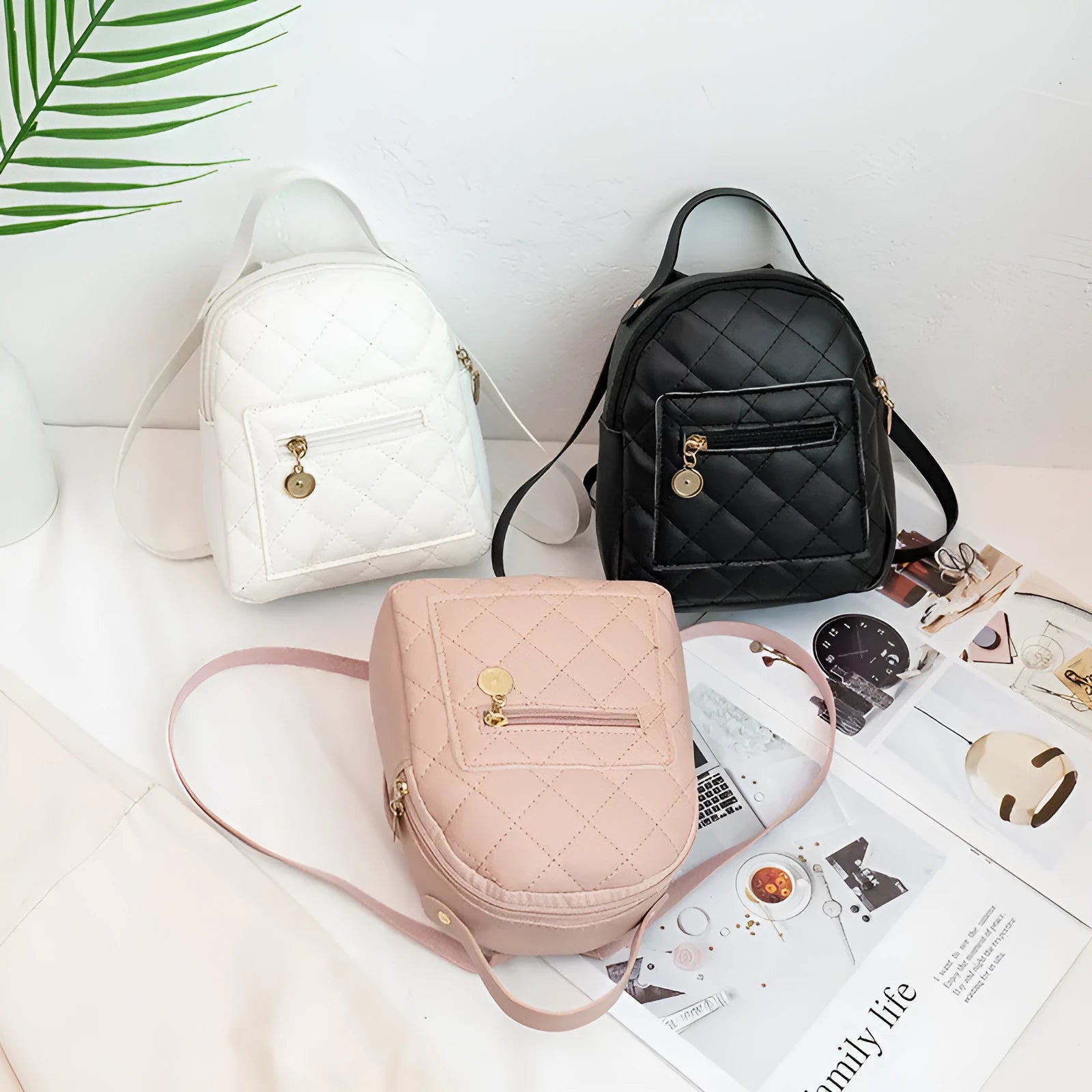 Hard square vertical girls' backpack in PU with embroidery, showing front sandwich pocket and soft carry handle.