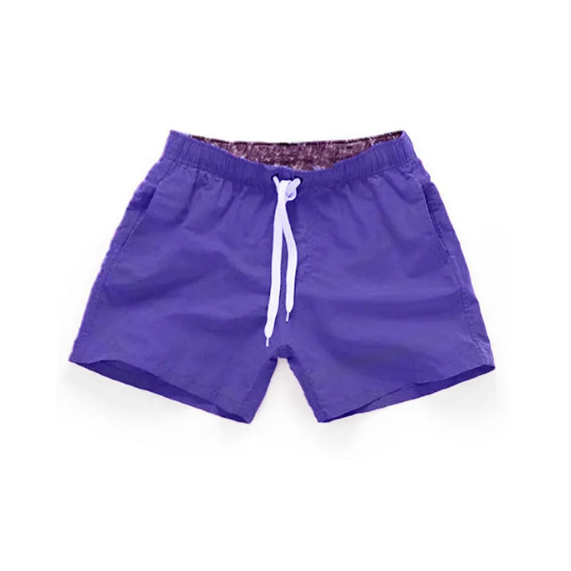 Men's straight leg beach shorts in polyester fabric available in multiple colours and sizes